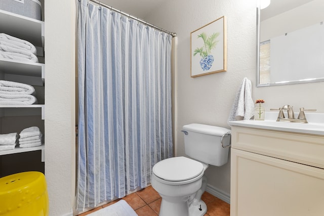 bathroom featuring vanity, tile patterned flooring, toilet, and a shower with curtain