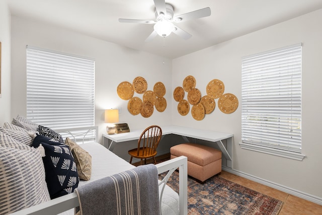 bedroom featuring tile patterned flooring and ceiling fan