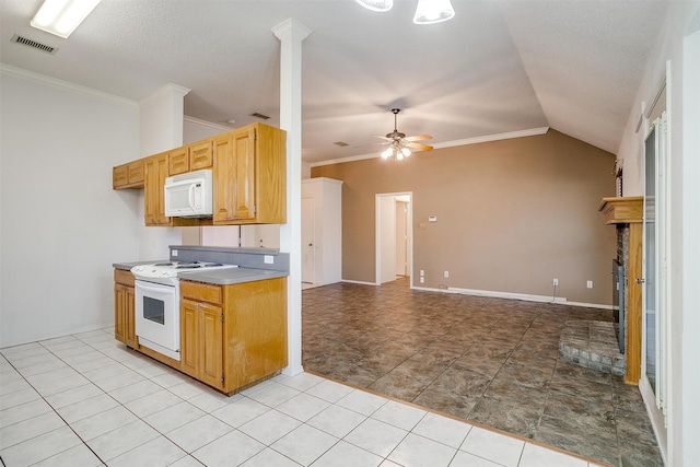 kitchen featuring ornamental molding, ceiling fan, white appliances, lofted ceiling, and a brick fireplace