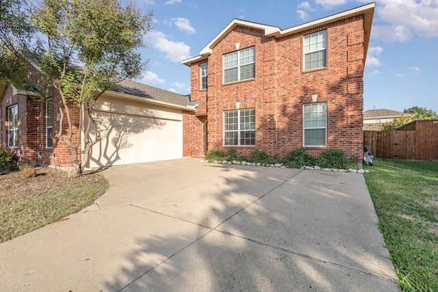 view of front of home with a garage and a front yard