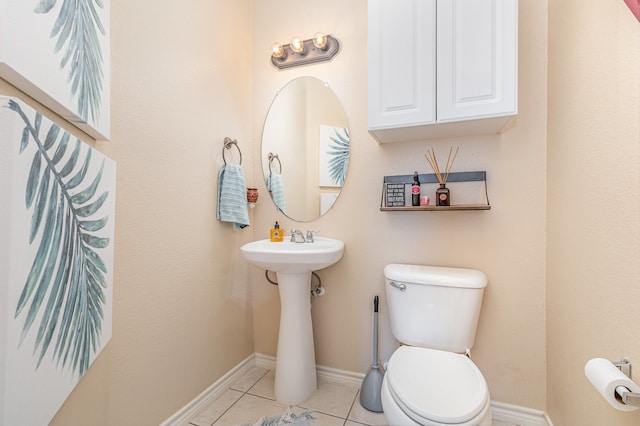 bathroom with tile patterned flooring and toilet