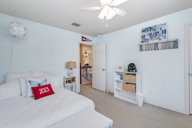 carpeted bedroom featuring ceiling fan