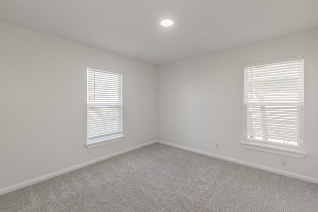 unfurnished room featuring carpet floors