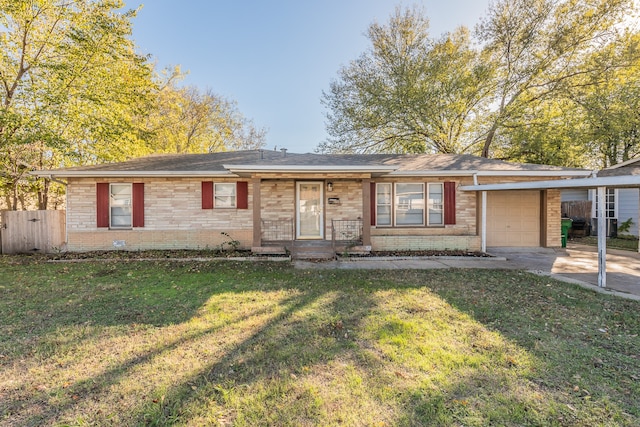 ranch-style home featuring a carport, a front yard, and a garage