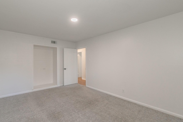 unfurnished room featuring carpet flooring