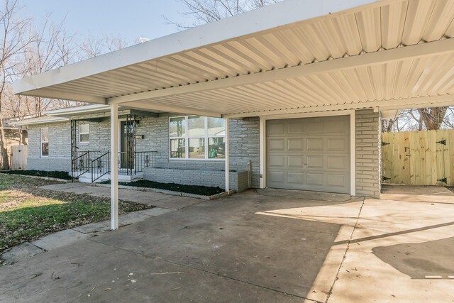 ranch-style house featuring a garage and a front lawn