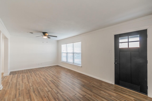 foyer entrance with hardwood / wood-style flooring and ceiling fan