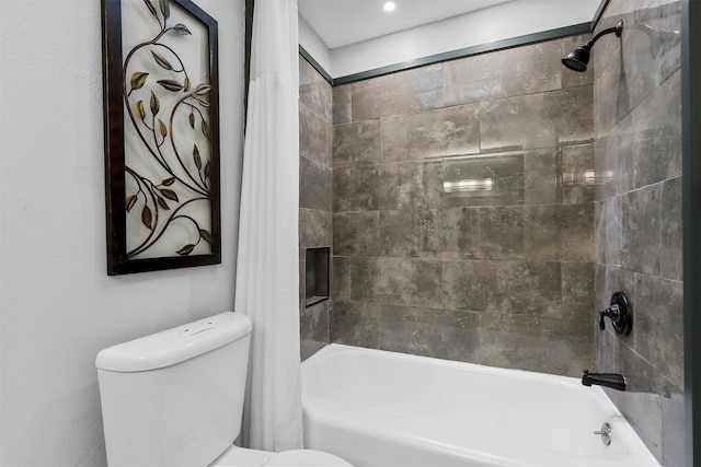 bathroom with toilet and shower / tub combo with curtain