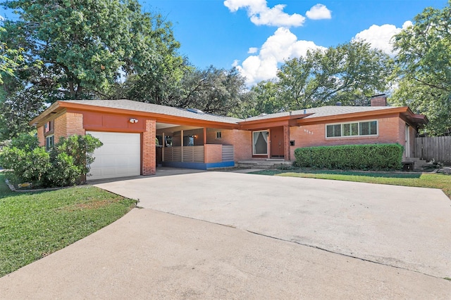 ranch-style house featuring a carport and a front lawn