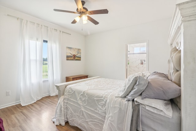 bedroom with light hardwood / wood-style flooring, multiple windows, and ceiling fan