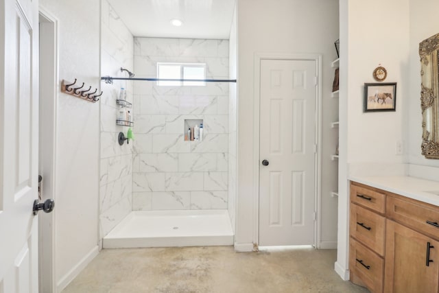 bathroom featuring vanity and a tile shower