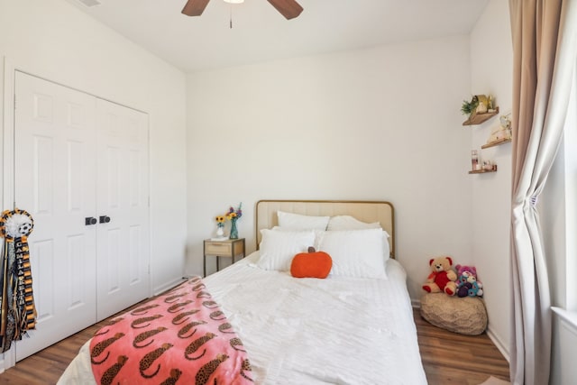 bedroom with ceiling fan, a closet, and hardwood / wood-style flooring