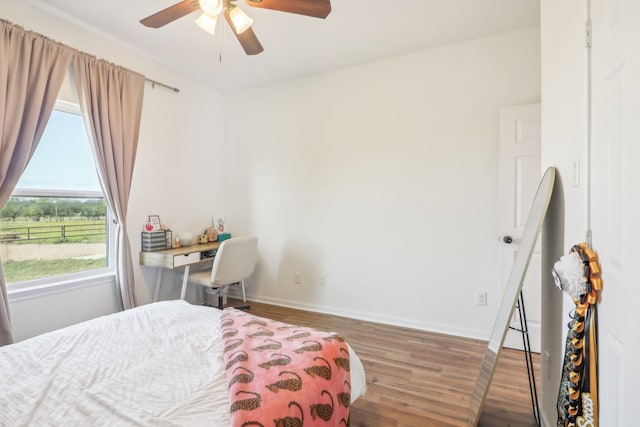 bedroom with wood-type flooring and ceiling fan