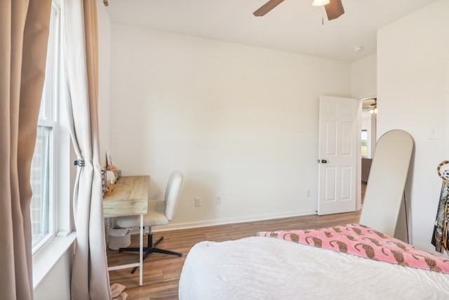 bedroom featuring hardwood / wood-style floors, a closet, and ceiling fan