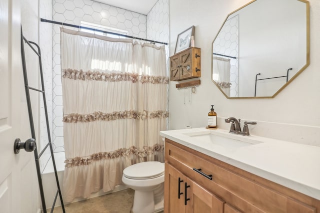 full bathroom with vanity, toilet, and shower / bath combo with shower curtain