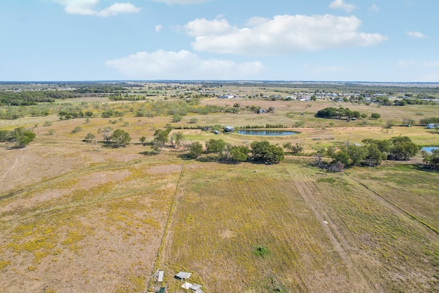 birds eye view of property with a rural view and a water view