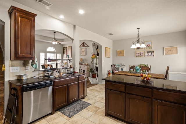 kitchen featuring dark brown cabinetry and stainless steel dishwasher