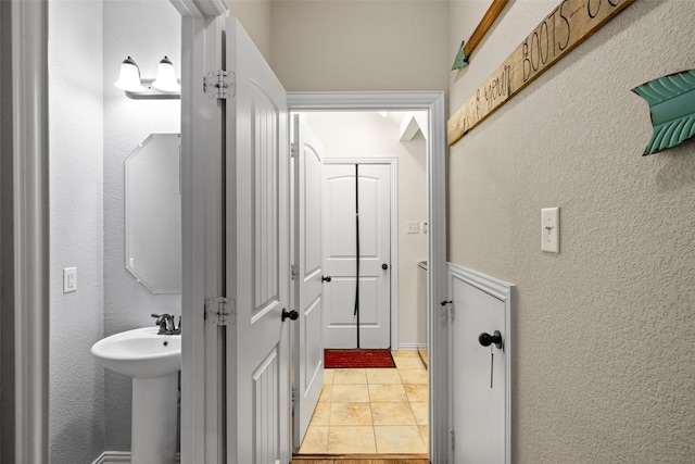 bathroom featuring tile patterned flooring and sink