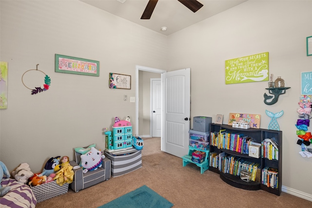 recreation room with ceiling fan and carpet flooring