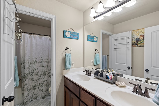 bathroom featuring vanity, toilet, and a shower with shower curtain