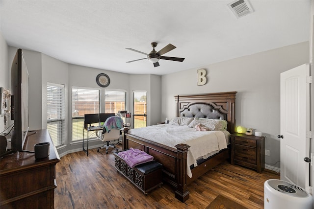 bedroom featuring ceiling fan and dark hardwood / wood-style flooring