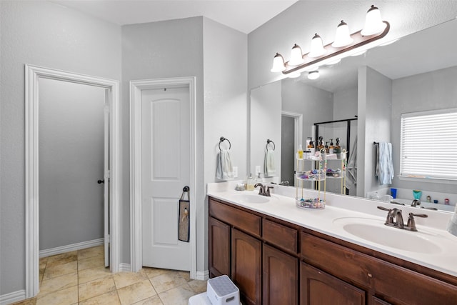 bathroom featuring tile patterned flooring, vanity, and independent shower and bath