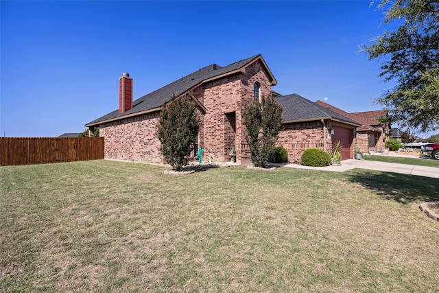 exterior space with a garage and a front yard