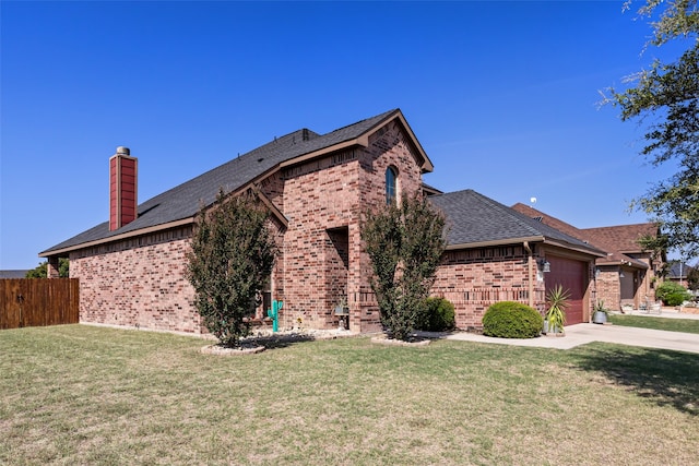 view of front of property with a garage and a front yard