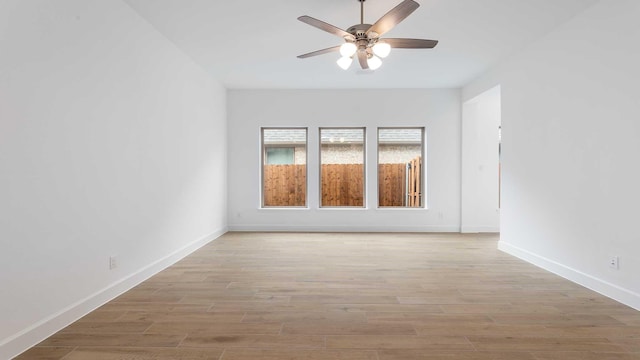 unfurnished room with ceiling fan and light hardwood / wood-style floors