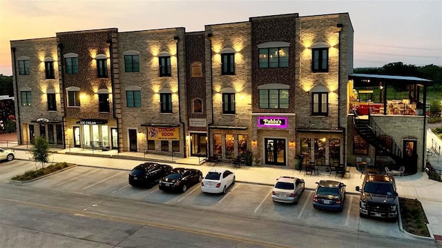 view of outdoor building at dusk