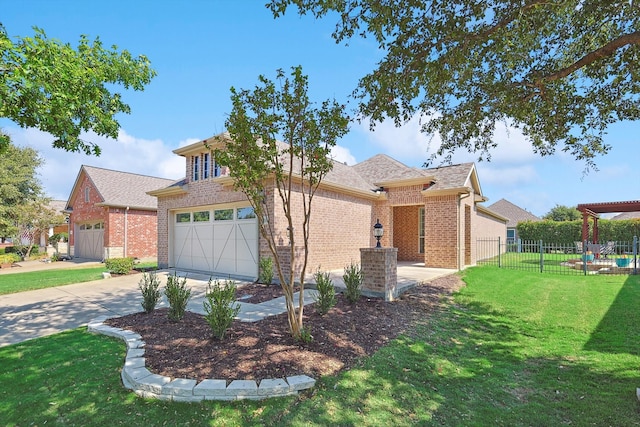 view of front of property featuring a garage and a front yard