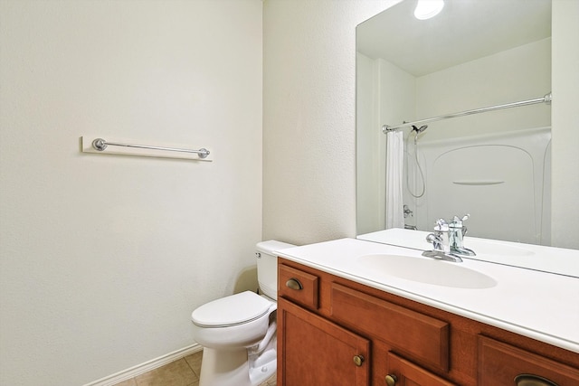 bathroom with tile patterned flooring, curtained shower, vanity, and toilet