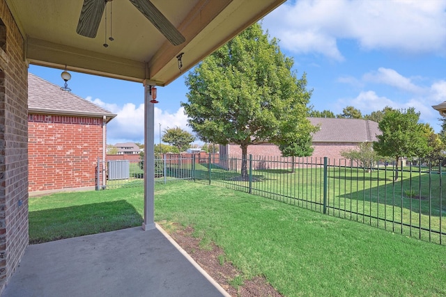 view of yard with ceiling fan and a patio