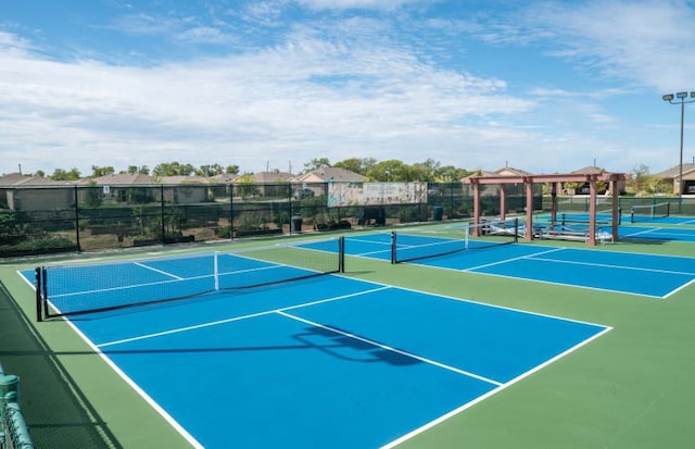 view of sport court featuring basketball hoop