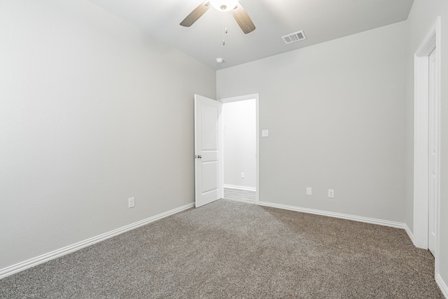 unfurnished bedroom with ceiling fan and carpet