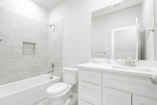 full bathroom with tiled shower / bath, vanity, tile patterned flooring, and toilet