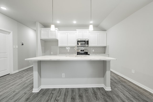 kitchen with pendant lighting, white cabinetry, and stainless steel appliances