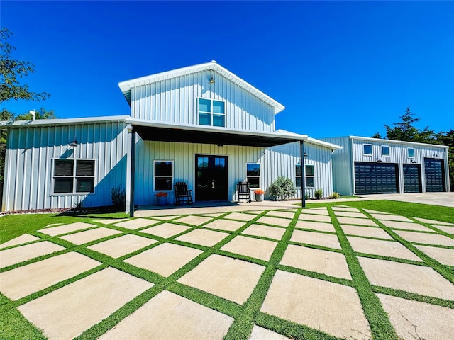 rear view of house featuring board and batten siding