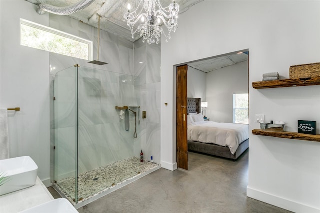 ensuite bathroom featuring a shower with door, connected bathroom, baseboards, and finished concrete floors