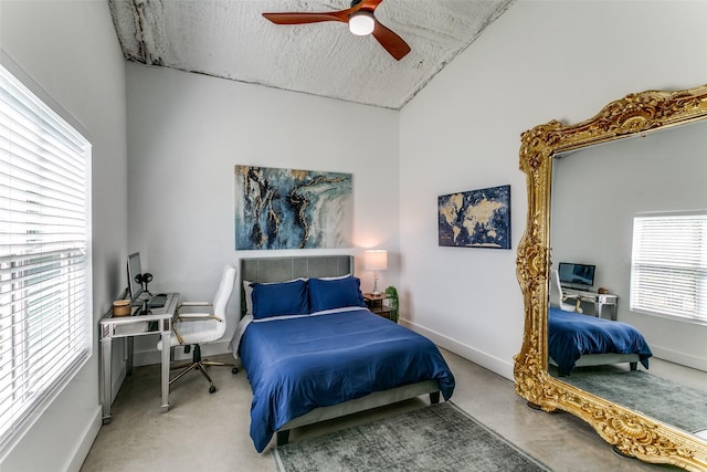 bedroom featuring ceiling fan, lofted ceiling, baseboards, and a textured ceiling