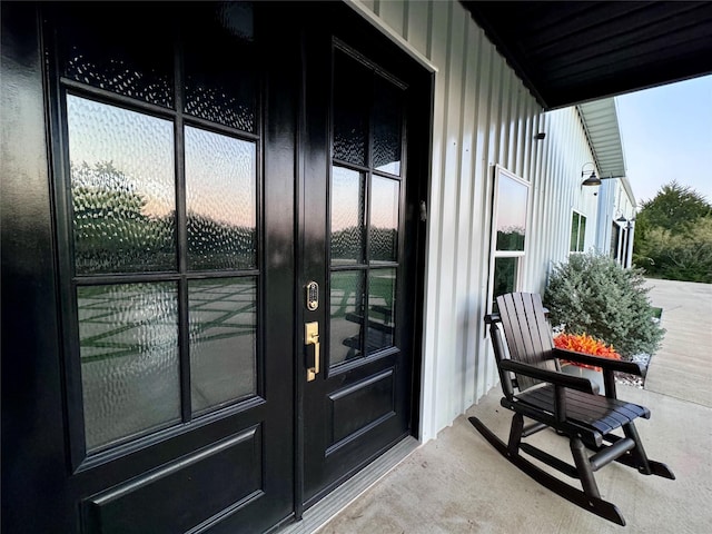 view of exterior entry featuring board and batten siding