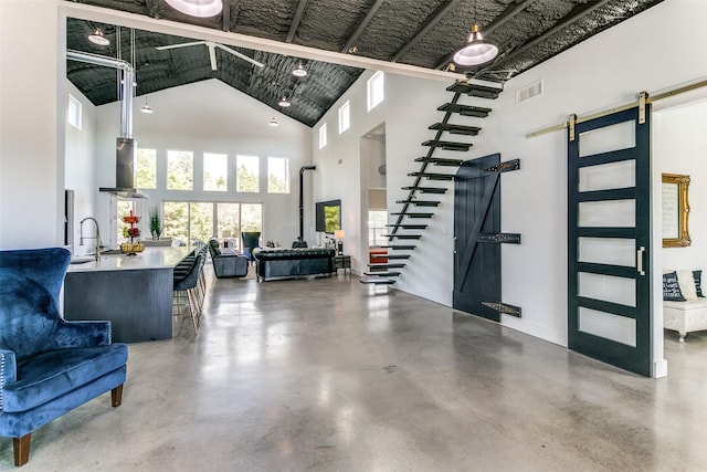 interior space featuring visible vents, stairs, and a sink