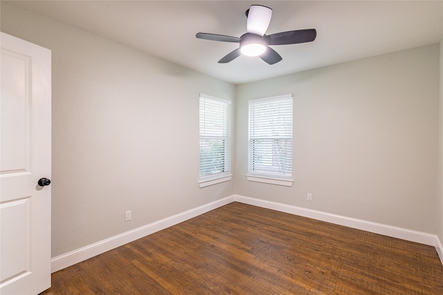 unfurnished room featuring ceiling fan and dark hardwood / wood-style floors