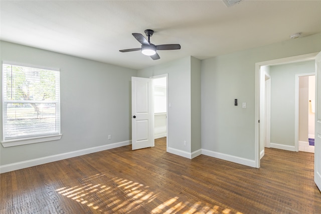 unfurnished bedroom featuring dark hardwood / wood-style flooring and ceiling fan