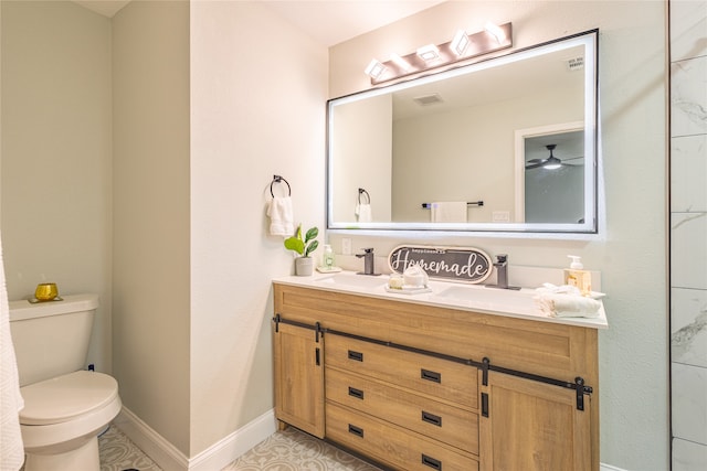 bathroom featuring ceiling fan, tile patterned floors, vanity, and toilet