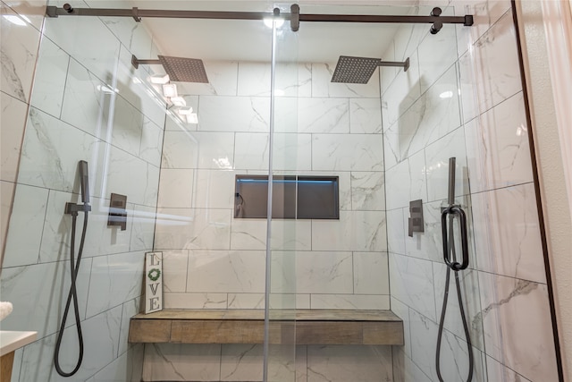 bathroom with a shower with door