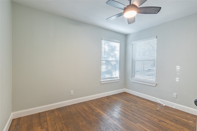 unfurnished room featuring ceiling fan and dark hardwood / wood-style floors