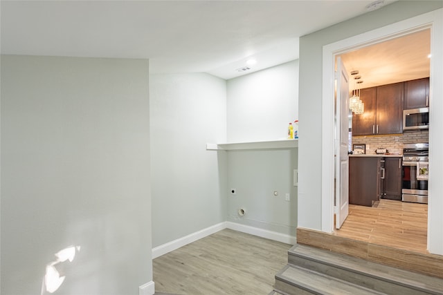 interior space featuring light wood-type flooring and electric dryer hookup