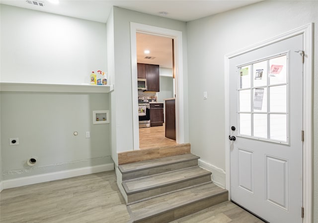 doorway featuring light hardwood / wood-style floors