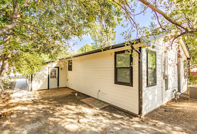 exterior space featuring central AC unit and a patio area